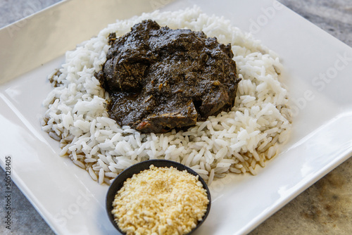 Maniçoba, a festive dish in Brazilian cuisine made with leaves of the Manioc plant. Traditional recipe of Belém, Pará, Amazon, Brazil.