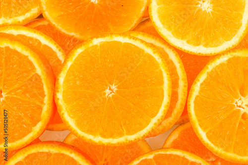 Abstract background with citrus-fruit of orange slices. Close-up of orange slices on white background. photo