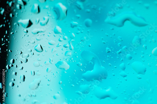 Water drops on glass background. Multi Color gradient texture or abstract background. Blank  template for screensaver.