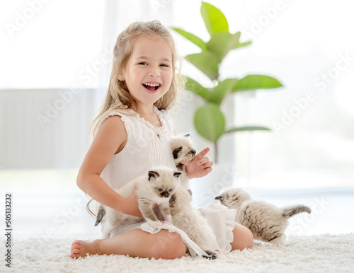 Girl with ragdoll kittens photo