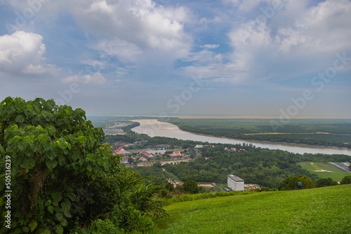 Aerial view from the Jugra Hill to the Klang valley and the Langat River at the West coast of Malaysia. At the horizon the street of Melaka. Cloudscape over the River Delta and the flat landscape photo