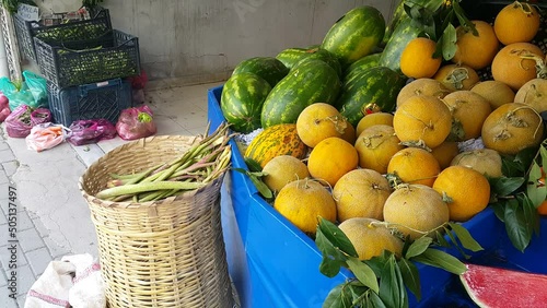 Melons and watermelons displayed at a grocery produce section, highlighting freshness, vibrant colors, and everyday fruit shopping in a local market.