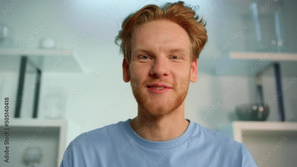 Closeup freelancer talk interview at home office. Smiling ginger man video call Closeup freelancer talk interview at home office. Smiling ginger man video call