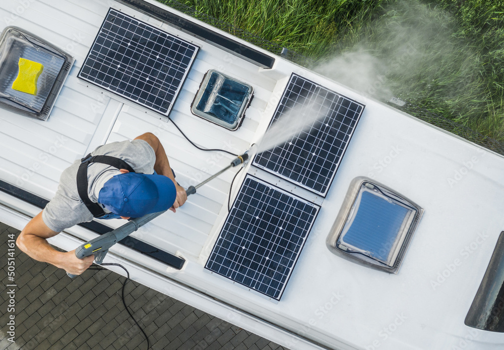 Men Power Washing His Camper Van RV Roof and Solar Panels - obrazy, fototapety, plakaty 