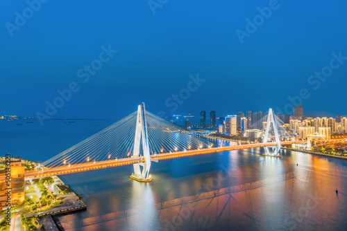 High angle night view of Haikou Century Bridge, Hainan, China © Govan