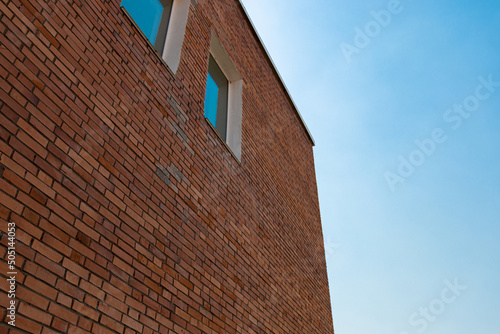 red brick building and sky background photo