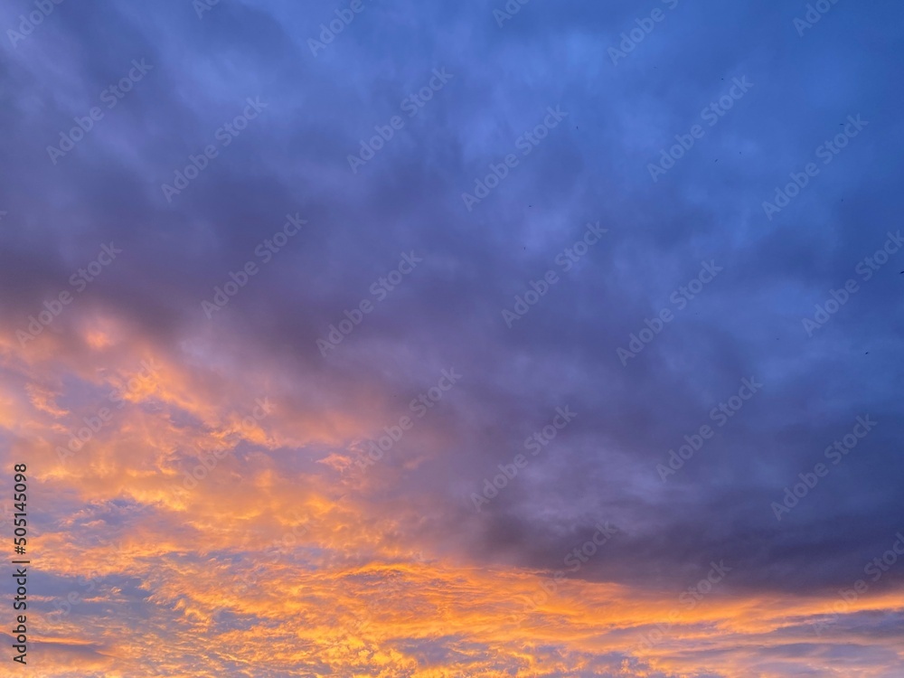 Beautiful sunset sky above the clouds with dramatic light.