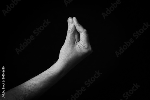 Pinched Fingers emoji isolated on black background