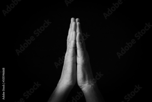 Folded Hands emoji isolated on black background