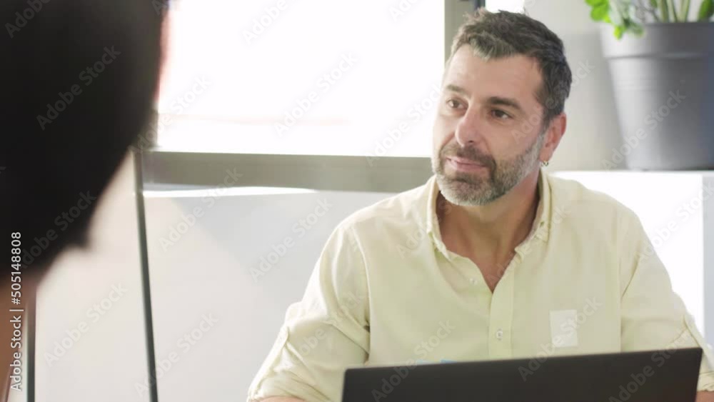 Group of people working in an office. Business meeting of multiracial startup team. Successfull colleagues brainstorming.. Group of people working in an office. Business meeting of multiracial startup team. Successfull colleagues brainstorming..