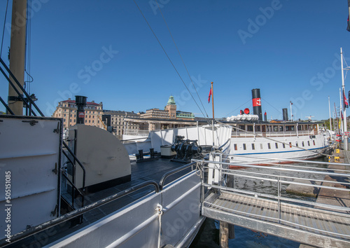 For of an old steam boat not in duty at a pier in the bay Nybroviken a sunny day in Stockholm
