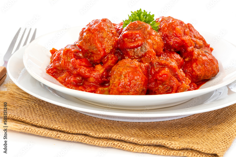 beef dumpling in tomato sauce in a plate on a burlap beef dumpling in tomato sauce in a plate on a burlap