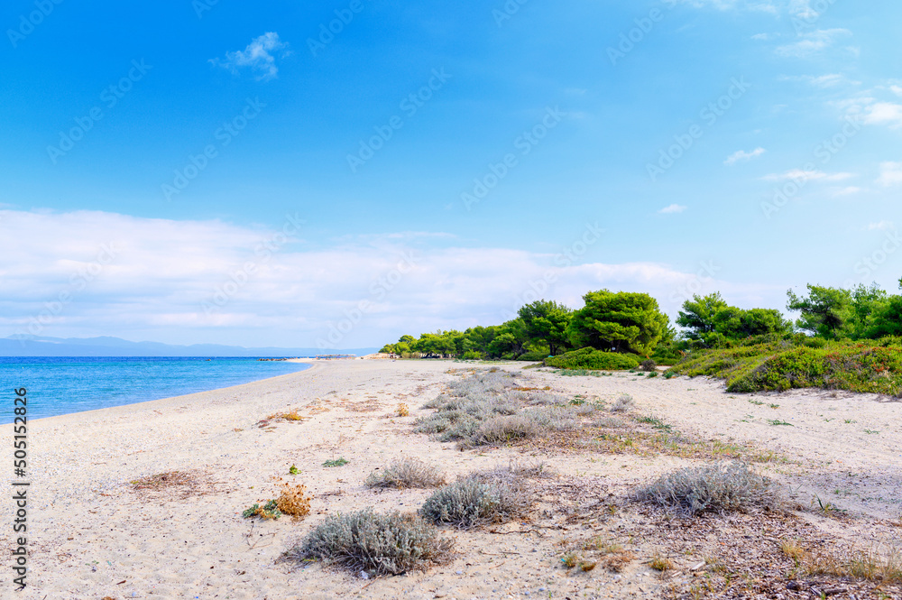 Beautiful panorama of summer seascape of Mediterranean sea. Green hills of Peloponnese peninsula, Greece, Europe.