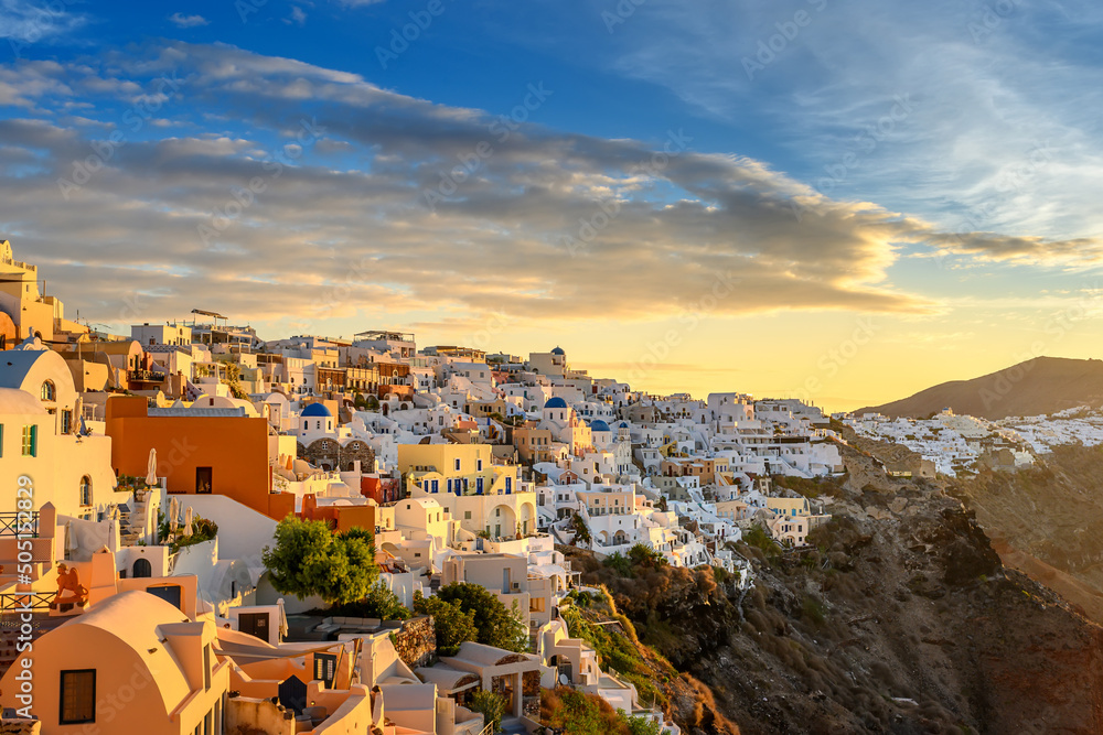 Picturesque sunset on famous view resort over Oia town on Santorini island, Greece, Europe. luxury travel. famous travel landscape. Summer holidays. Travel concept background..
