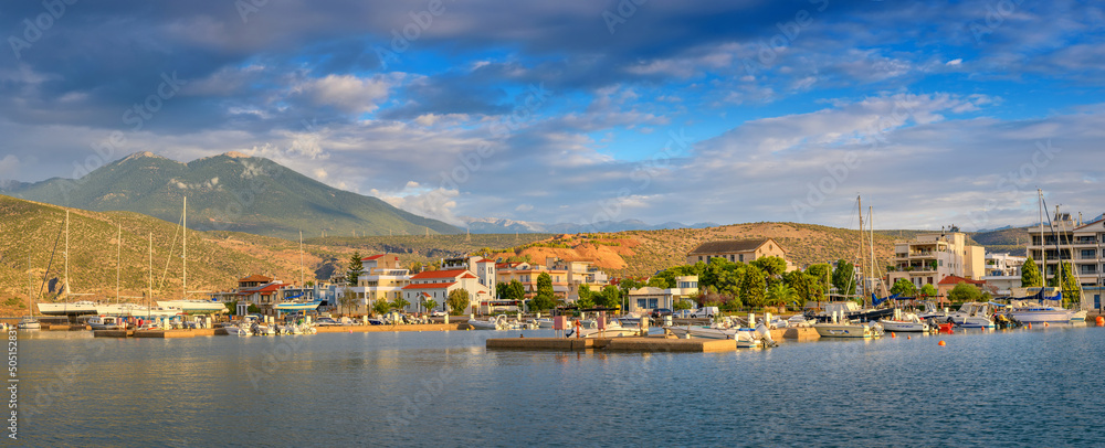 Yachts and boats in marina in resort town. Docked luxury yacht Boat in a port..
