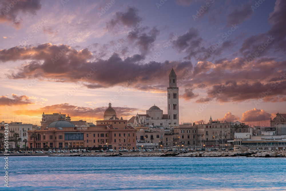 Obraz premium Panoramic view of Bari, Southern Italy, the region of Puglia(Apulia) seafront at Sunset. Basilica San Nicola in the background. 