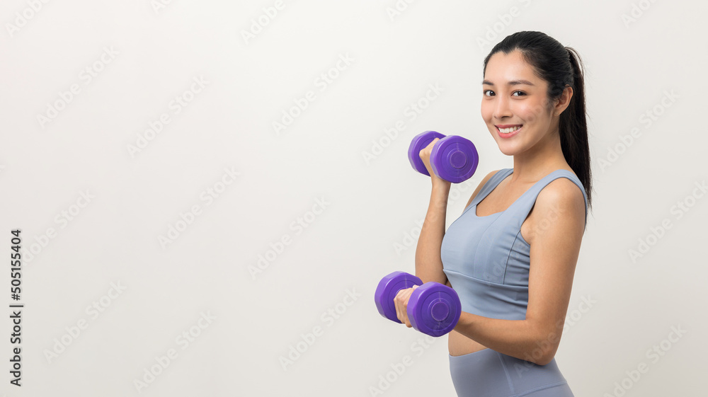 Sporty Asian woman exercises with dumbbells on isolated white background. Good shape and health fitness woman weight training standing pose smile to camera. Sporty Asian woman exercises with dumbbells on isolated white background. Good shape and health fitness woman weight training standing pose smile to camera.