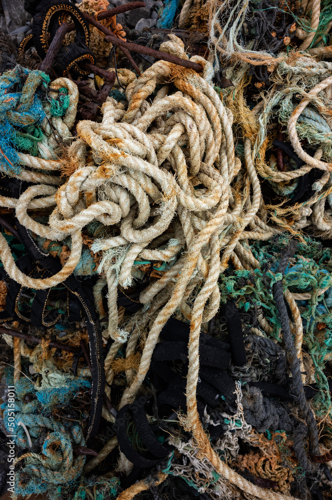 Close -up on Discarded Nylon and rope Fishing Net Washed Up on the Shore, west coast of Ireland.
