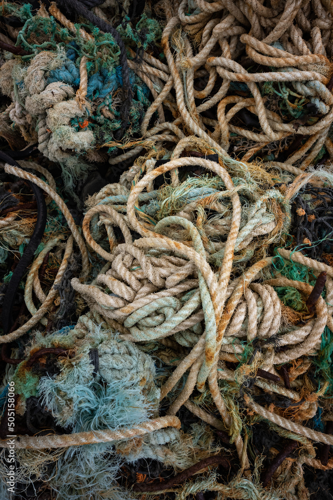 Close -up on Discarded Nylon and rope Fishing Net Washed Up on the Shore, west coast of Ireland.