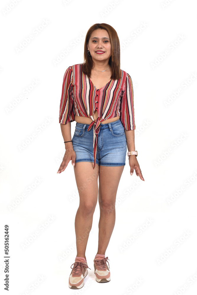 portriat of a women with shorts and sneakers on white background portriat of a women with shorts and sneakers on white background