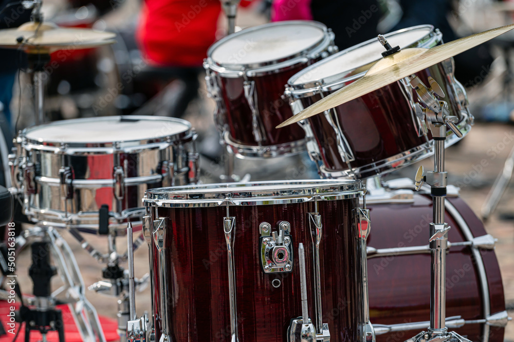 A set of plates in a drum set. At a concert of percussion music, selective focus, closeup A set of plates in a drum set. At a concert of percussion music, selective focus, closeup
