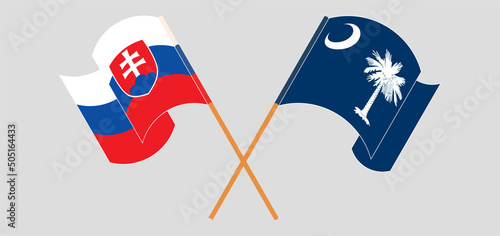 Crossed and waving flags of Slovakia and The State of South Carolina