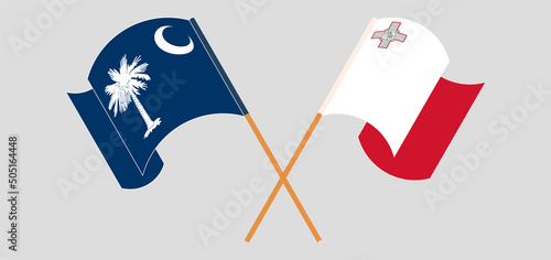 Crossed and waving flags of The State of South Carolina and Malta