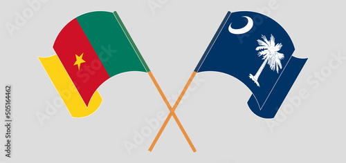 Crossed and waving flags of Cameroon and The State of South Carolina