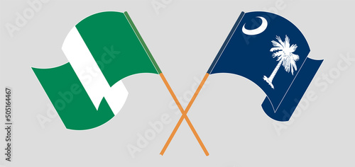 Crossed and waving flags of Nigeria and The State of South Carolina