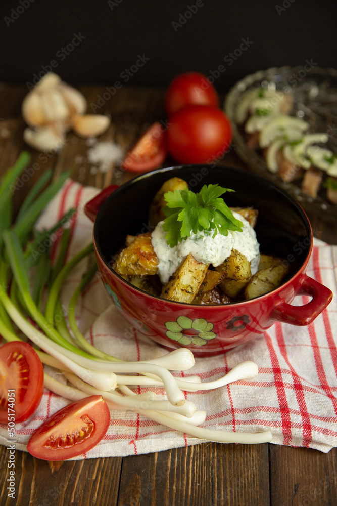 fried new potatoes with sauce and greens, with herring, tomato and green onion fried new potatoes with sauce and greens, with herring, tomato and green onion