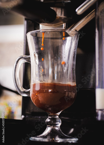  Coffee being extracted in the machine