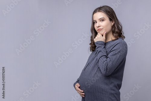 Fototapeta A pregnant young woman's doubts and agonies of choice