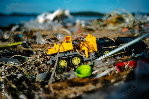 Fotografie Plastic waste floating in the sea was washed ashore and landed on the beach