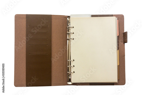 Open brown leather cover ring planner isolated on white background.