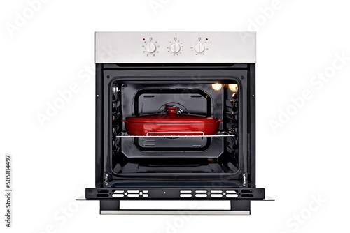 Black oven with silver control panel, three round control knobs. Open door, with a red baking dish, inside lights on. Front view. Isolate on white