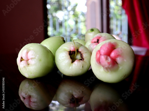 Some fresh Wax Apples with soft background,Some ripe jamruls or Java Apples photo