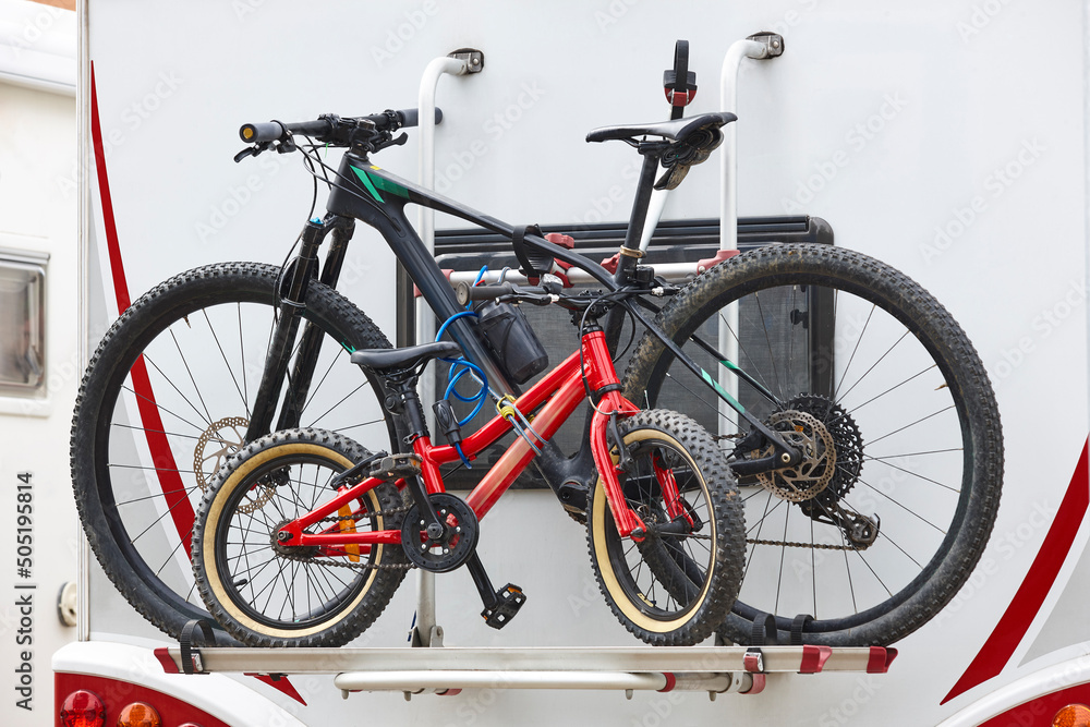 Bikes hanging on an recreational vehicle. Caravaning lifestyle Bikes hanging on an recreational vehicle. Caravaning lifestyle