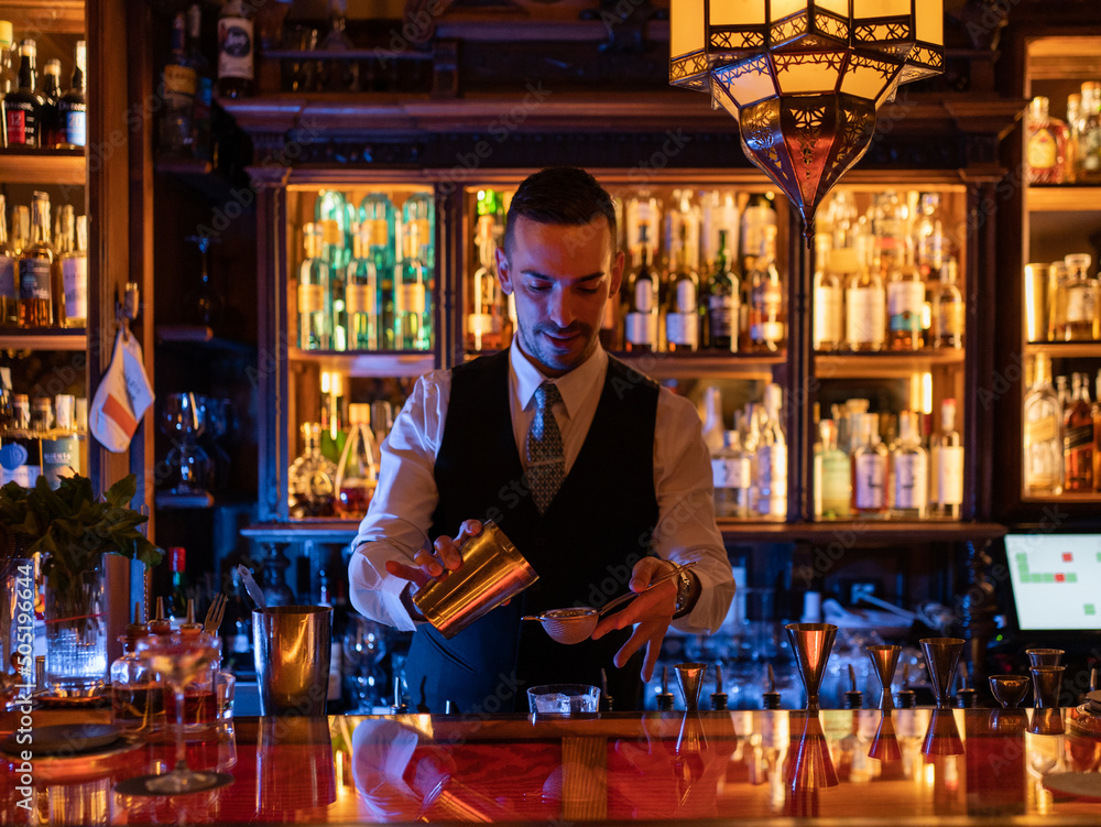 barkeeper made a cocktail on front of nightclub barkeeper made a cocktail on front of nightclub