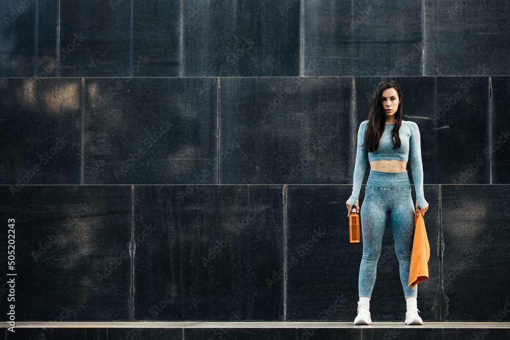Victory and success, beautiful fitness girl strong and confident woman posing outdoor. Victory and success, beautiful fitness girl strong and confident woman posing outdoor.