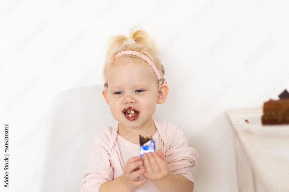Baby with cochlear implants at home. Deafness and medical technology concept. Baby with cochlear implants at home. Deafness and medical technology concept.
