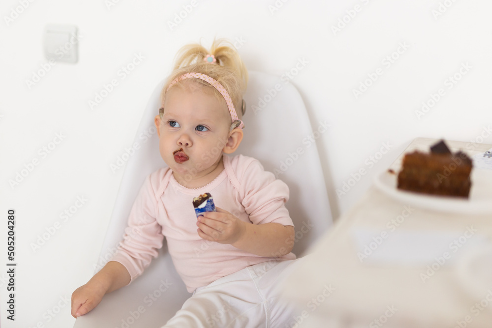 Baby with cochlear implants at home. Deafness and medical technology concept. Baby with cochlear implants at home. Deafness and medical technology concept.