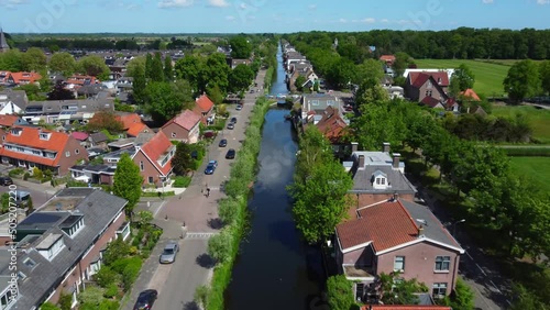 Long straight sgravelandsche Vaart running through idyllic Kortenhoef aerial view above countryside houses photo