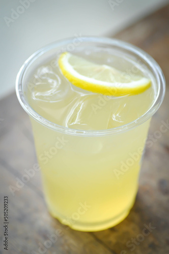 lime juice or lemon juice, lemon soda or tonic or soda and lime slice topping