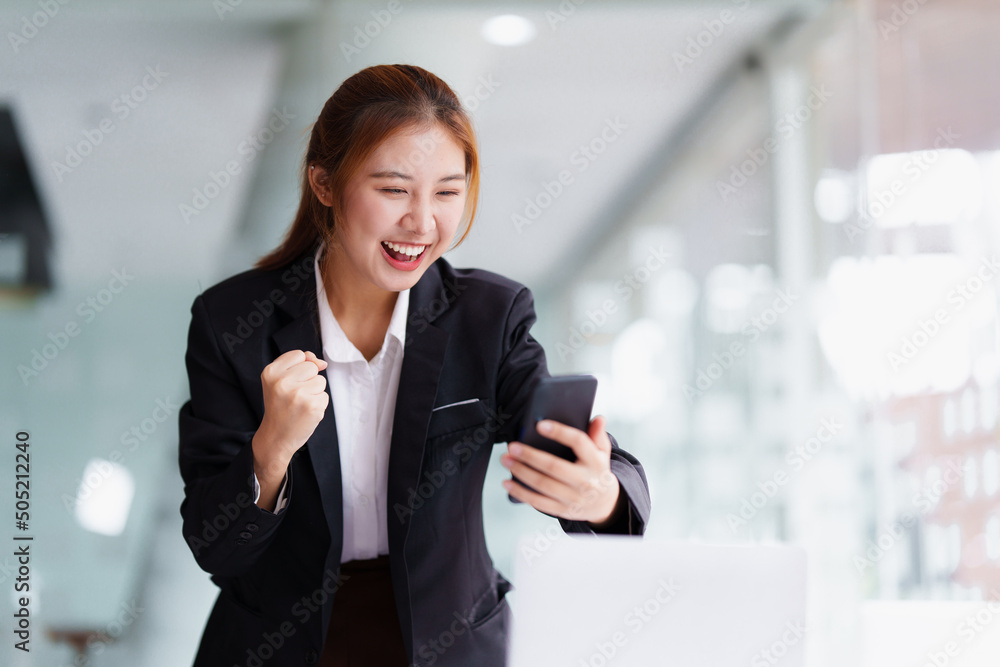 Successful business woman excited when her business growth and good news. Finance concept. Successful business woman excited when her business growth and good news. Finance concept.