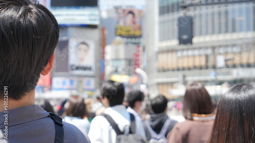 Shibuya Scramble Square people walking on the street