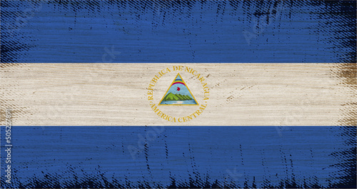NICARAGUAflag insoled on wood texture with rectangular frame vintage. photo