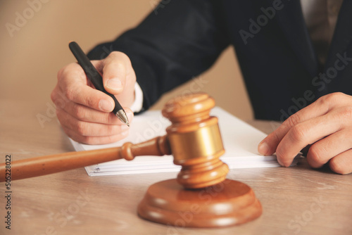 man hand wooden judge with document