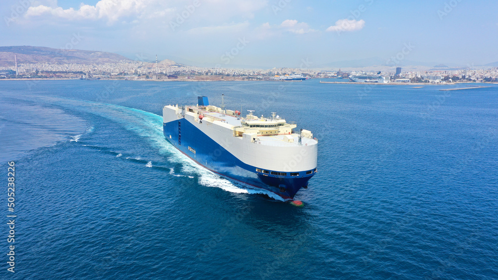 Aerial drone photo of Large RoRo (Roll on-off) car transportation vessel cruising the Mediterranean deep blue sea