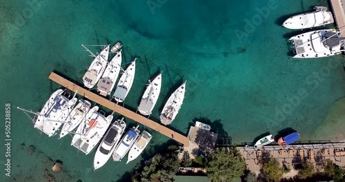 Top view of beautiful yachts in the marina filmed from the air