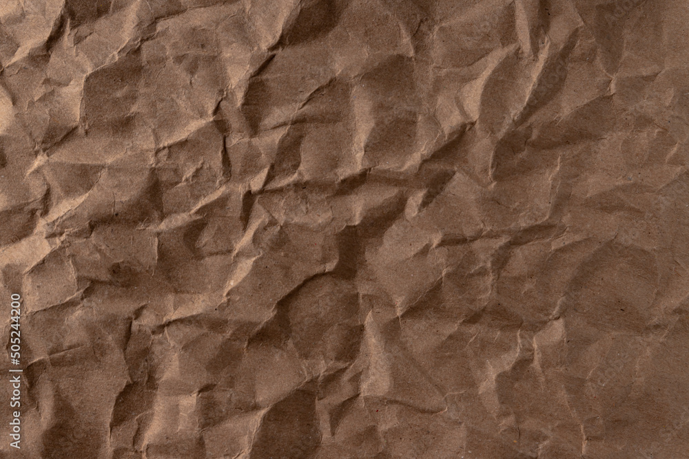 crumpled paper.sheet of brown cardboard paper. detailed high resolution texture. abstract background for wallpaper. crumpled paper.sheet of brown cardboard paper. detailed high resolution texture. abstract background for wallpaper.